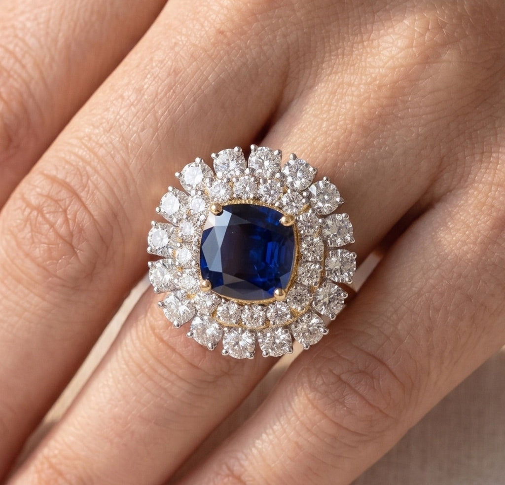 Cushion cut blue sapphire halo engagement ring with moissanite cluster in 14K yellow gold