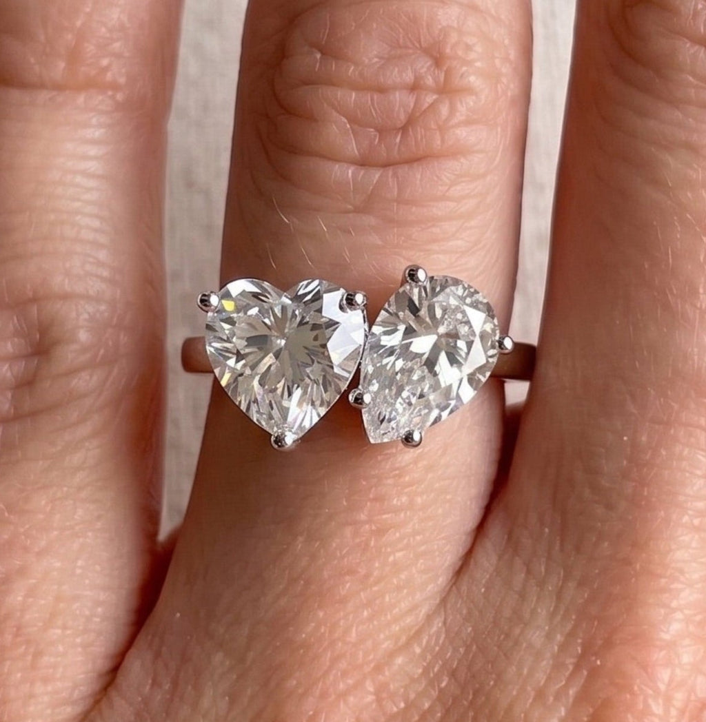 Toi et moi moissanite engagement ring with heart and pear cut stones in 14K white gold