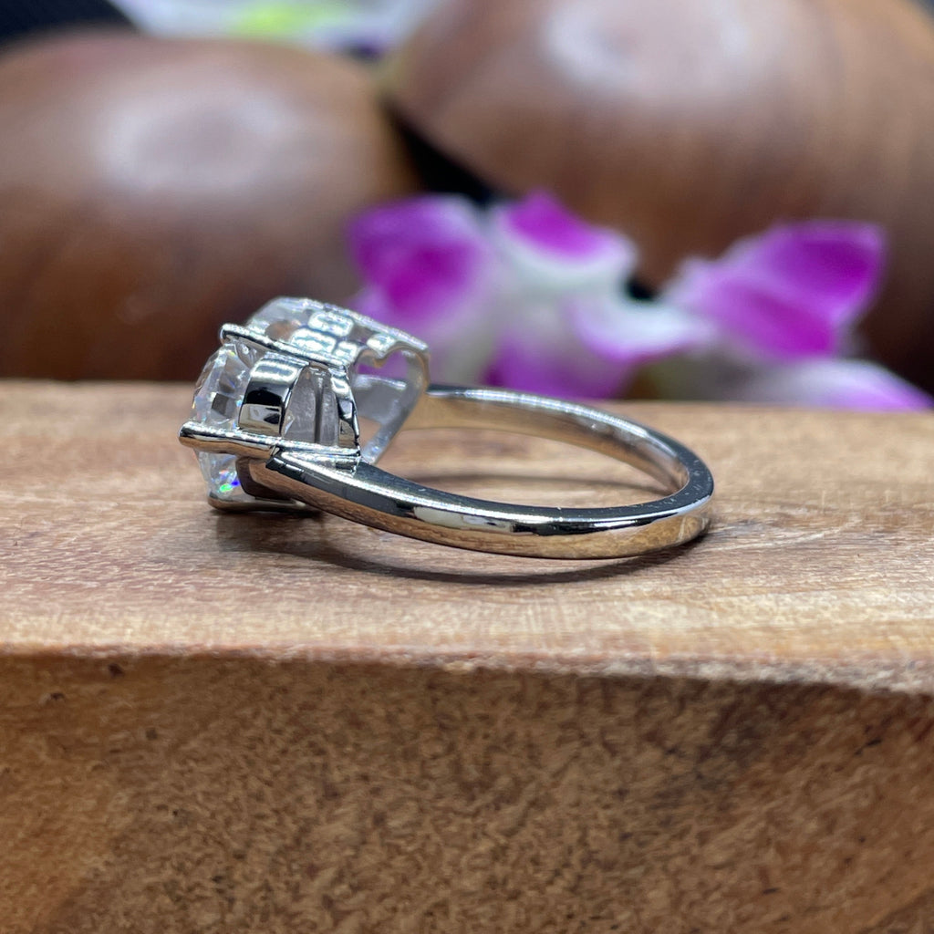 Toi et moi moissanite engagement ring with heart and pear cut stones in 14K white gold