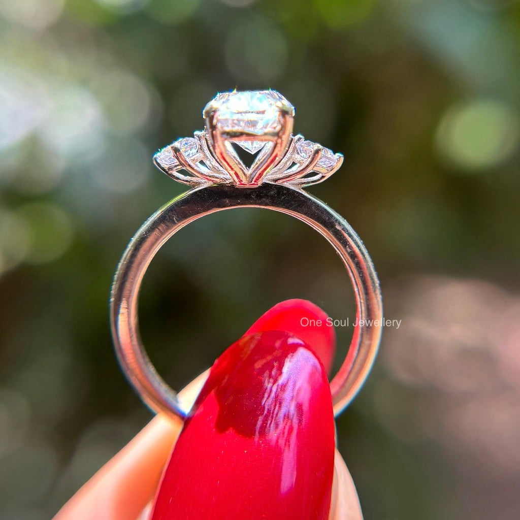 Oval cut moissanite three stone engagement ring in 14K white gold with VVS colorless center stone