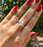 Oval cut moissanite three stone engagement ring in 14K white gold with VVS colorless center stone