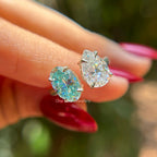 Toi et moi engagement ring with cyan blue oval moissanite and colorless pear moissanite in 14K white gold